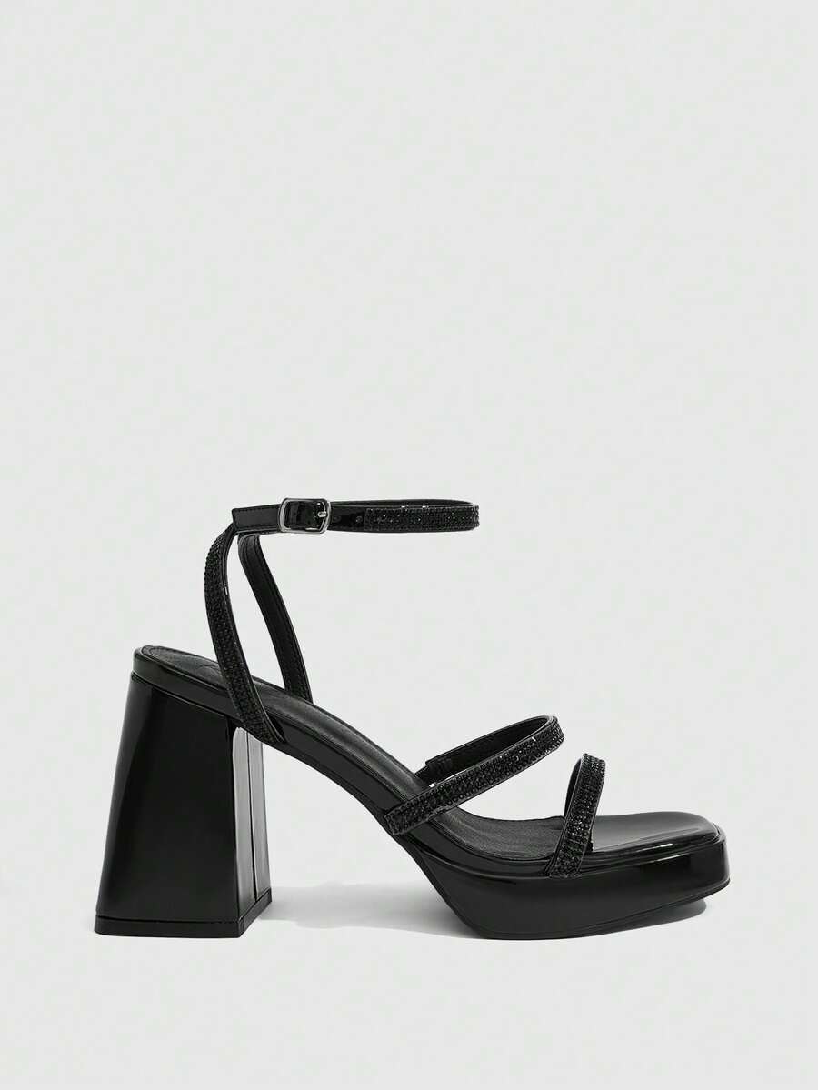 Women's high-heeled sandals with textured pattern, open toe design, chunky heel, and adjustable ankle buckle strap.