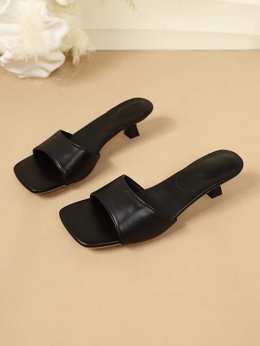Women's colorblock thong sandals featuring thin straps, a modern square toe, and kitten heels.