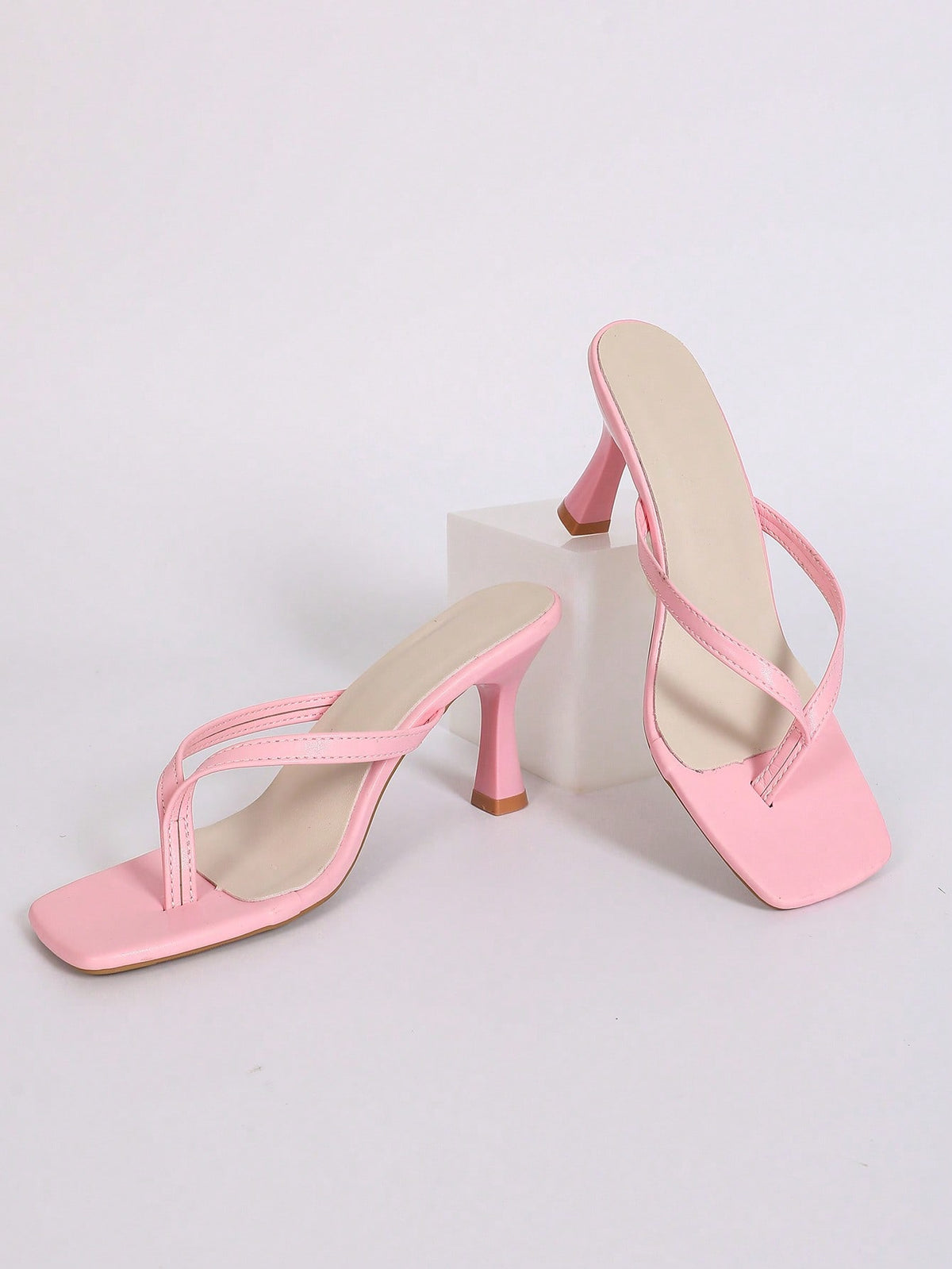 Women's open square toe high heel thong sandals with a sleek slip-on strap and stiletto heel.