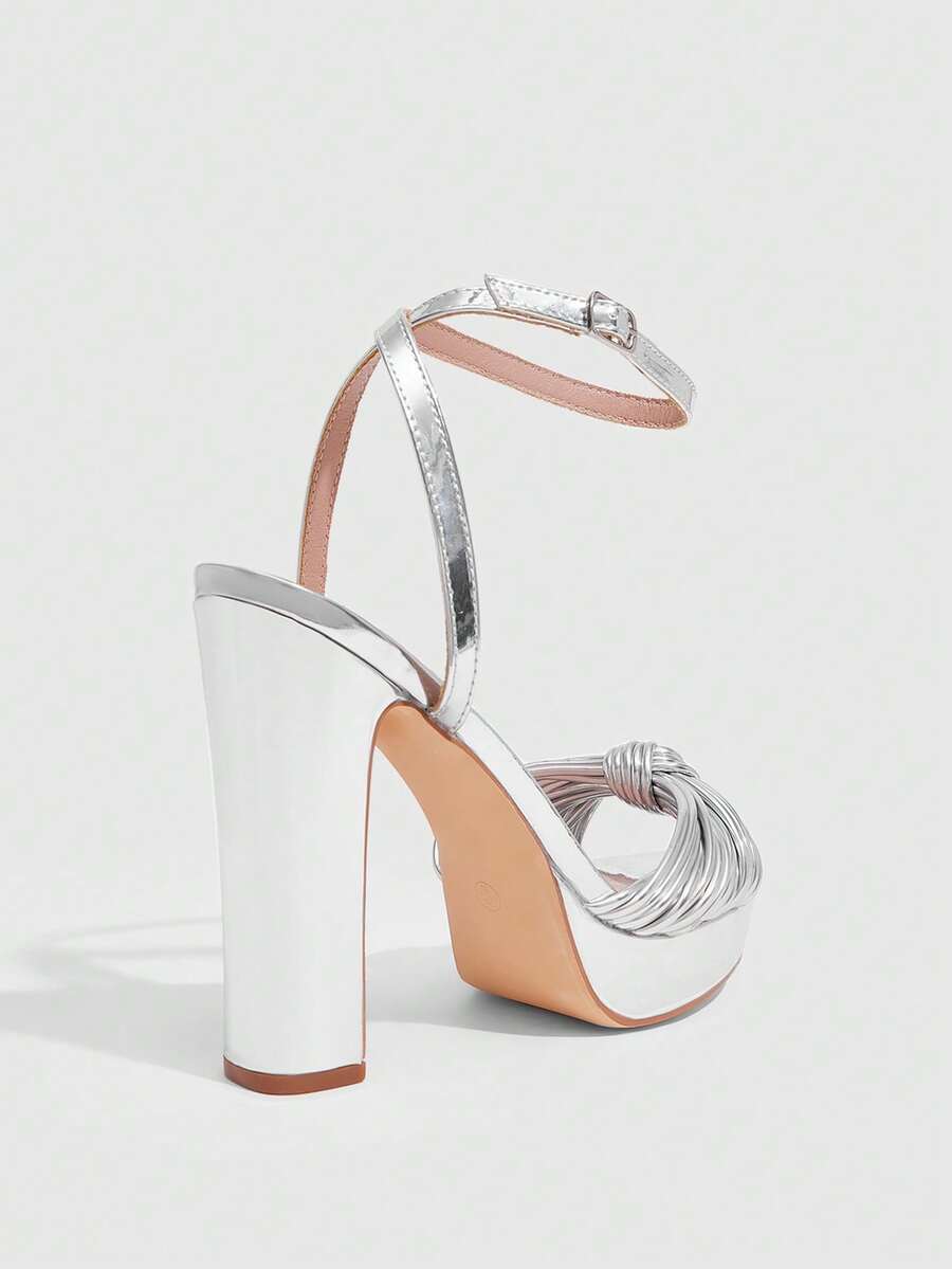 Women's platform block heel sandals featuring an open toe design and an adjustable ankle strap buckle closure.