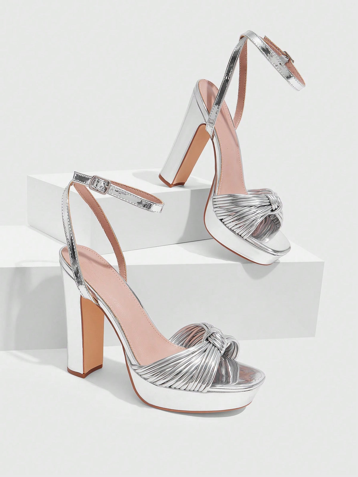 Women's platform block heel sandals featuring an open toe design and an adjustable ankle strap buckle closure.