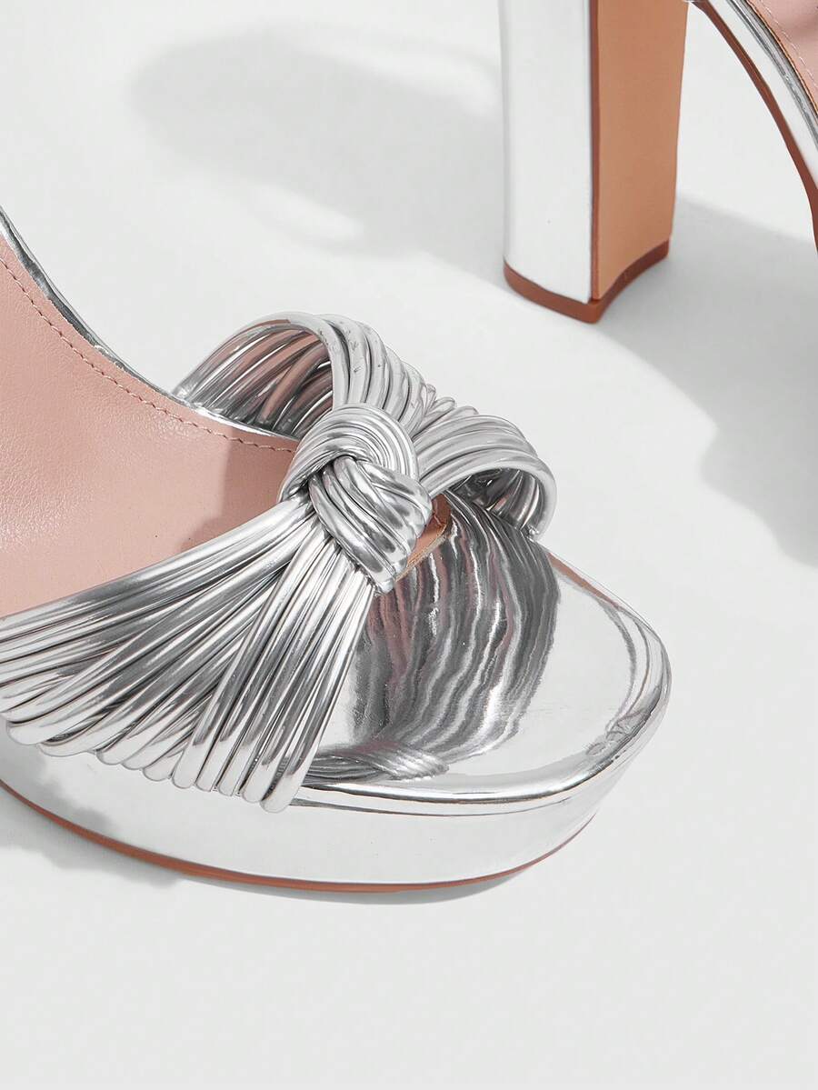 Women's platform block heel sandals featuring an open toe design and an adjustable ankle strap buckle closure.