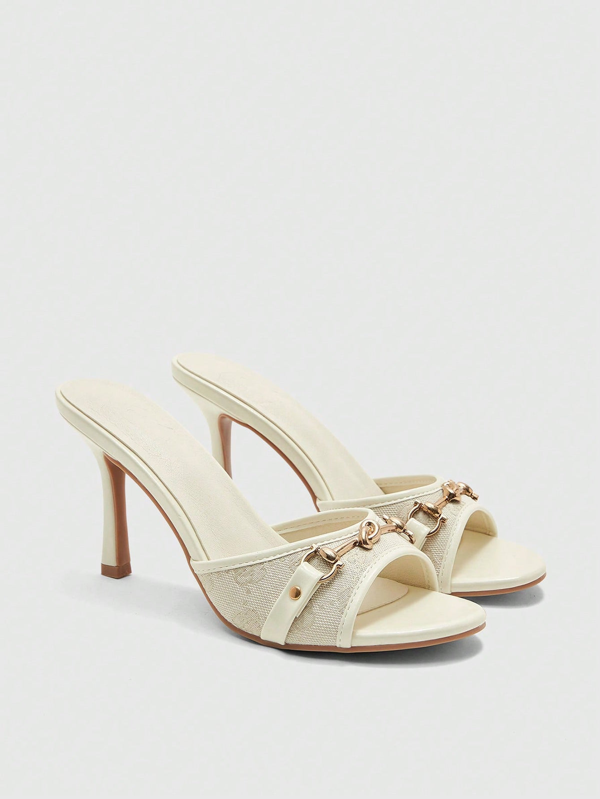 Women's beige high heel mule sandals with open round toe and metal chain detail
