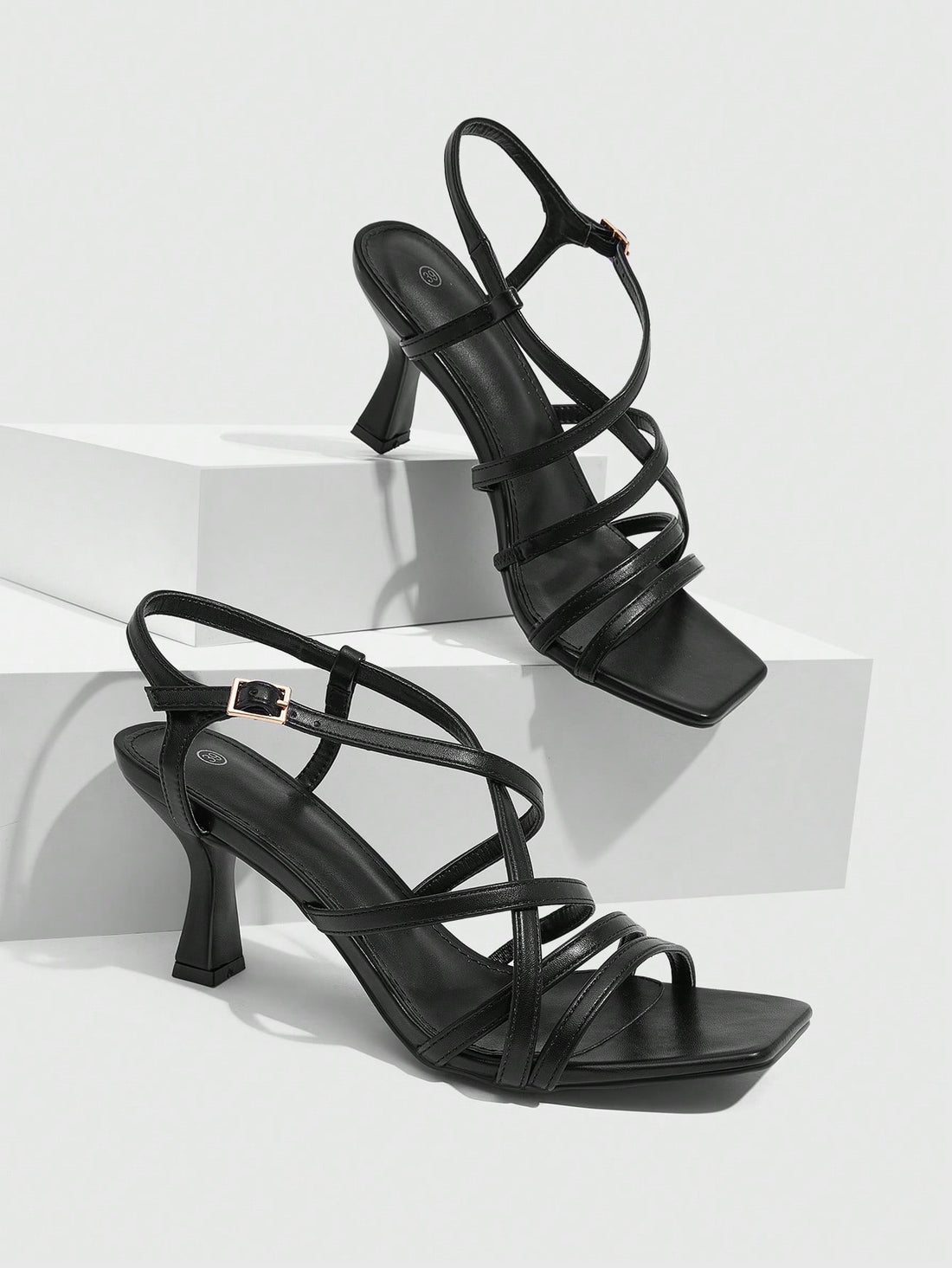 Women's metallic square toe Roman high heel sandals featuring cross straps and adjustable ankle buckle.