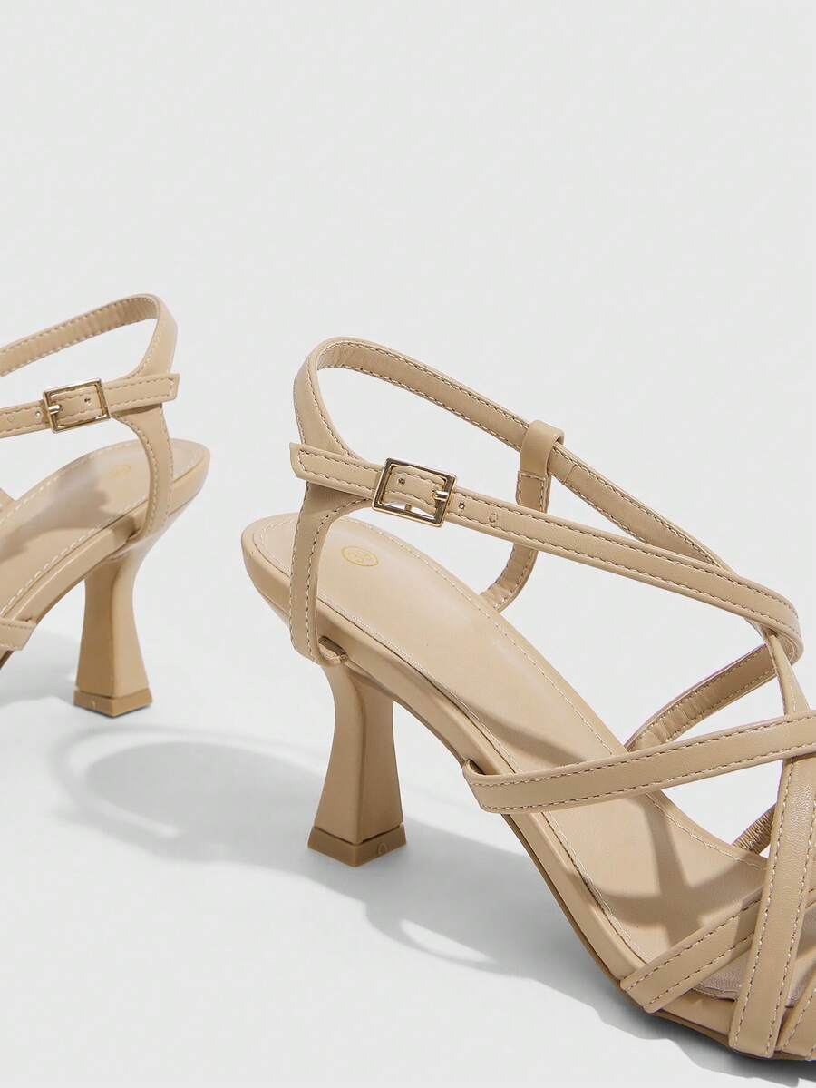 Women's metallic square toe Roman high heel sandals featuring cross straps and adjustable ankle buckle.
