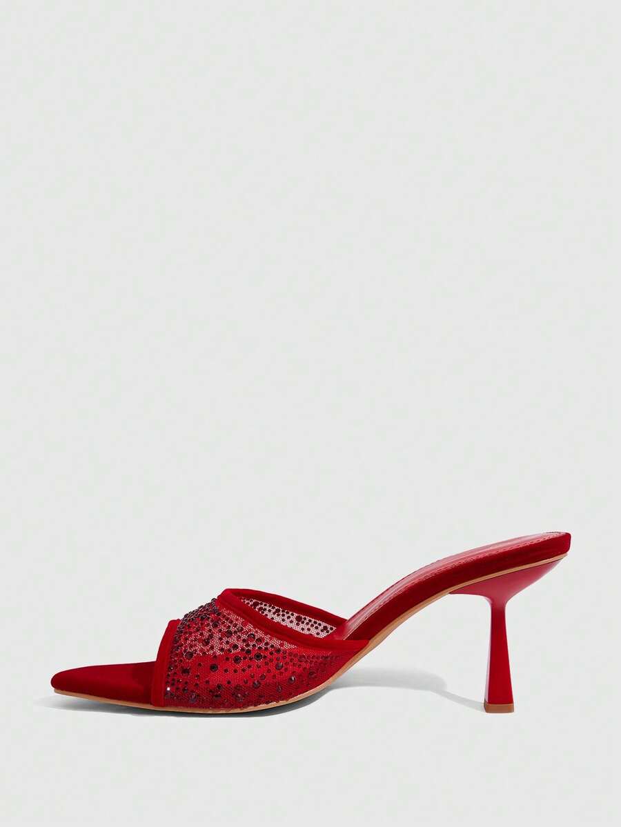 Red mesh pointed open-toe stiletto high-heeled sandals and mules embellished with sparkling rhinestones for wedding and banquet occasions.