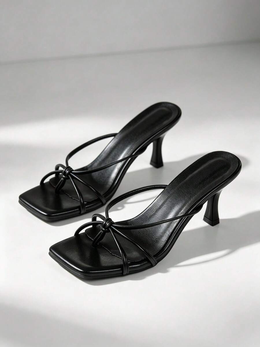 Women's open toe high heel sandals and slides featuring a slip-on design and mid pyramid heel.