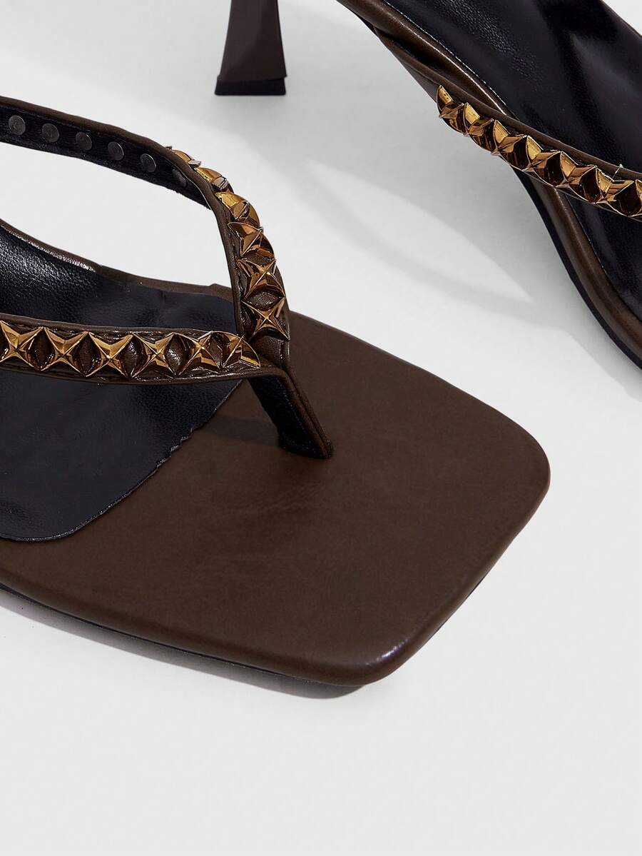 Elegant ladies strappy high-heeled slippers featuring a sleek toe post, buckle accent, and stiletto mid heel in smooth PU leather.