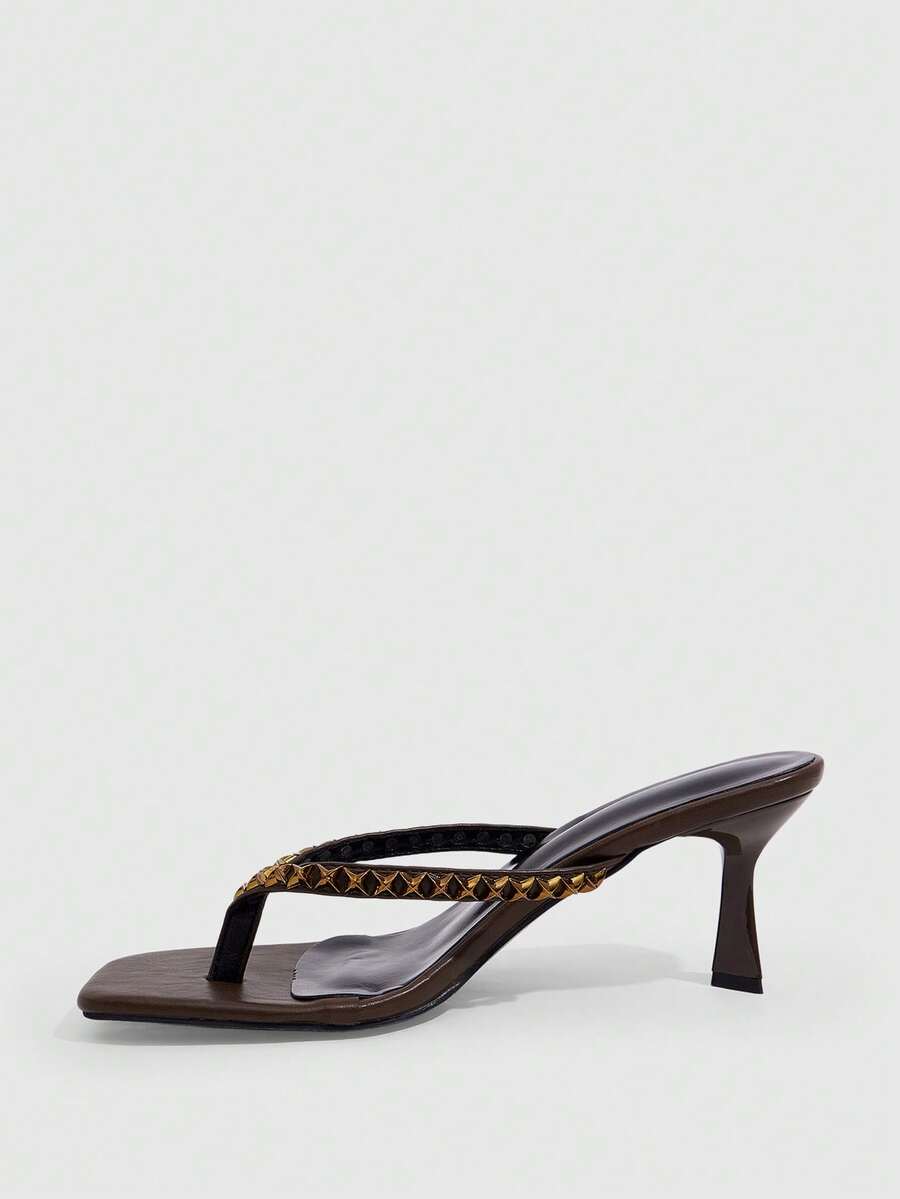 Elegant ladies strappy high-heeled slippers featuring a sleek toe post, buckle accent, and stiletto mid heel in smooth PU leather.