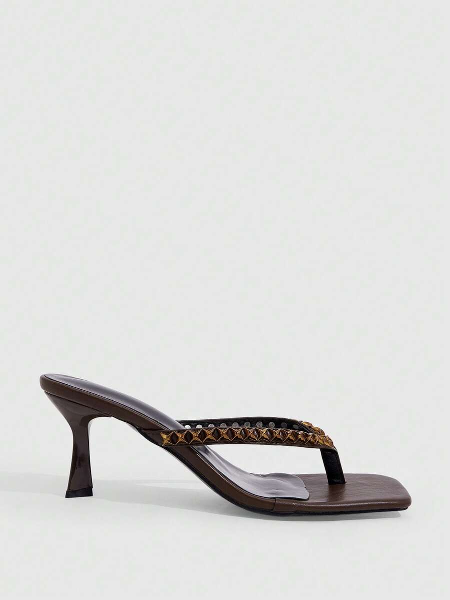 Elegant ladies strappy high-heeled slippers featuring a sleek toe post, buckle accent, and stiletto mid heel in smooth PU leather.