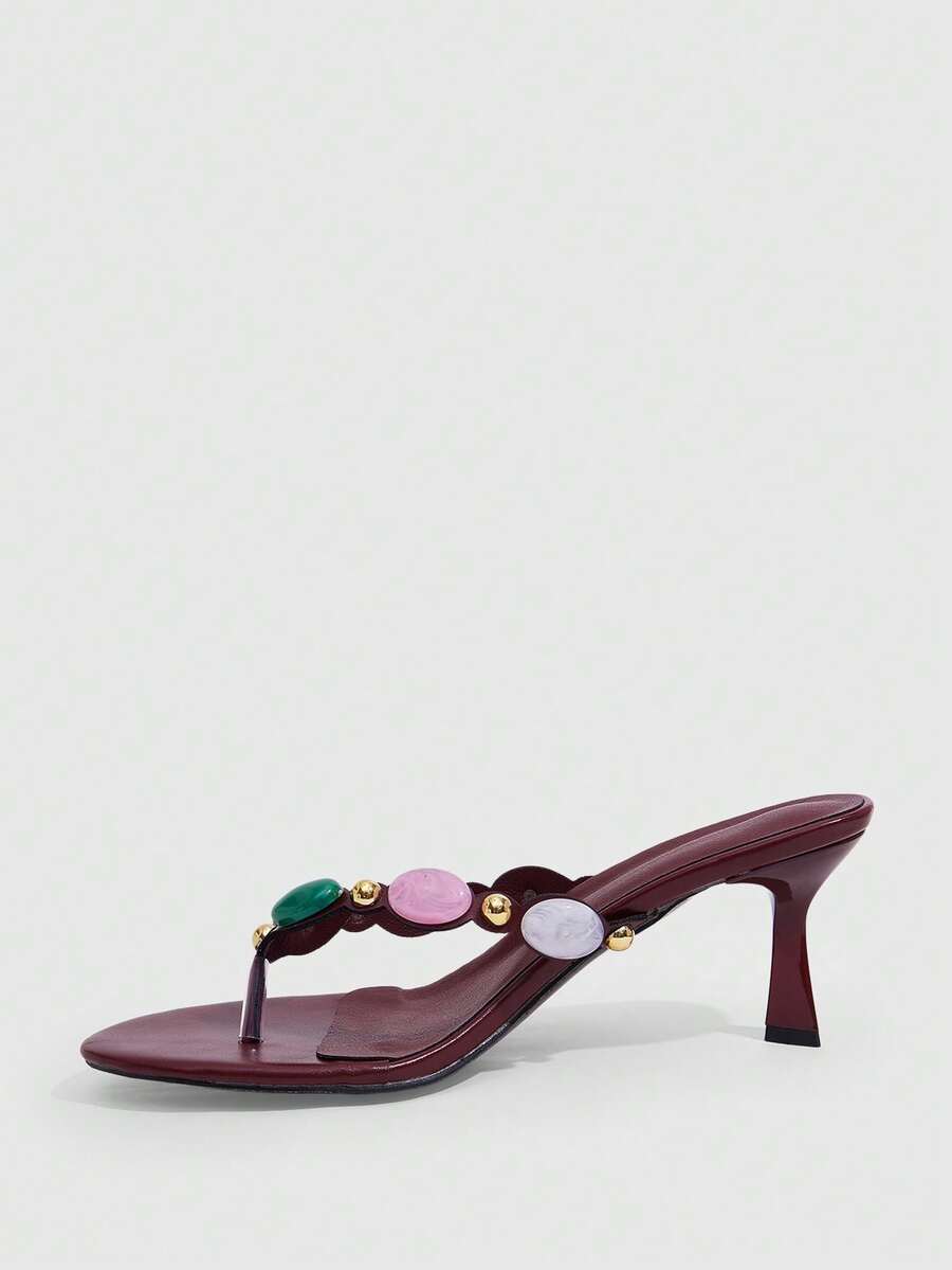 Elegant ladies strappy high-heeled slippers featuring a sleek toe post, buckle accent, and stiletto mid heel in smooth PU leather.