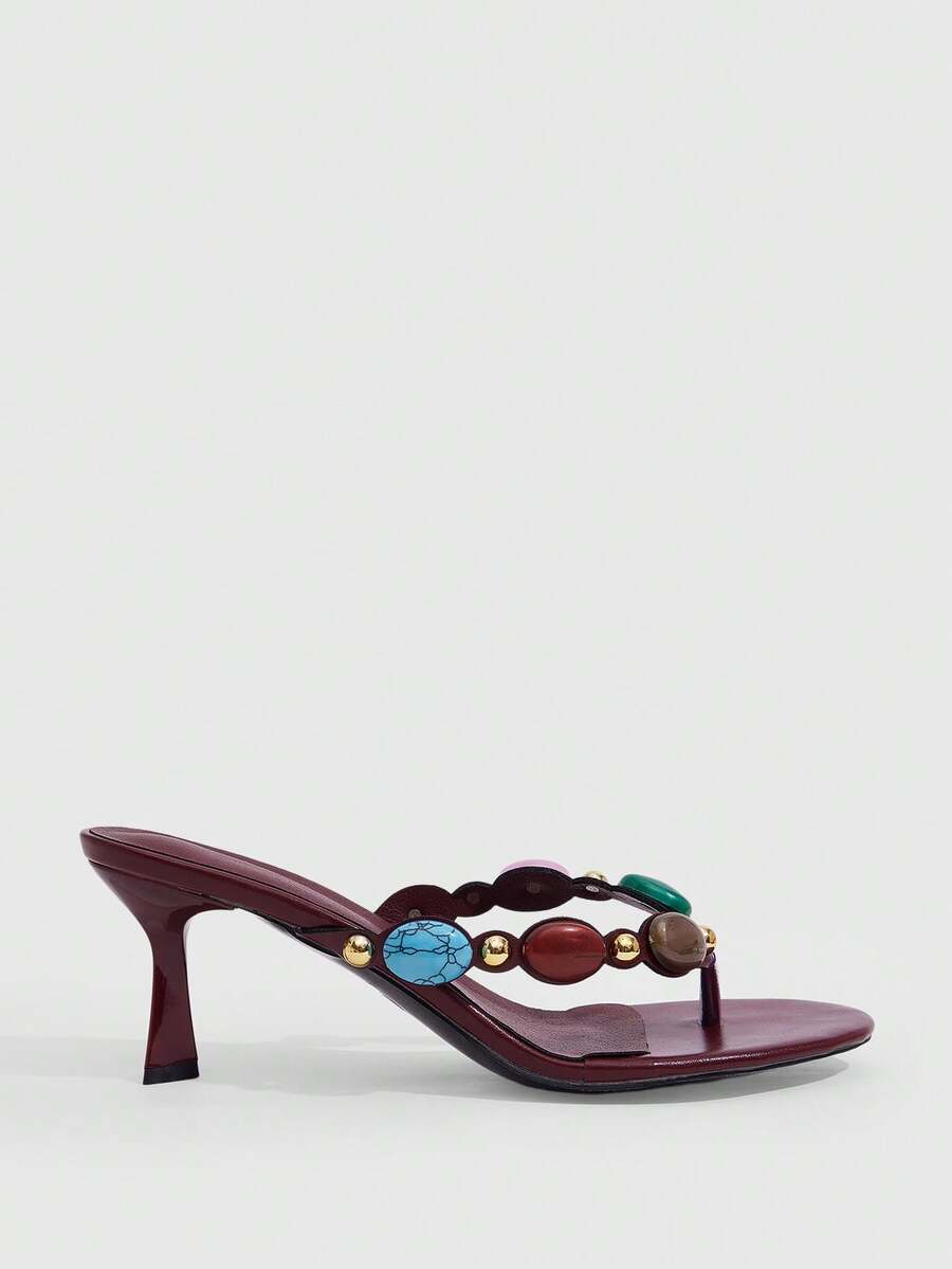 Elegant ladies strappy high-heeled slippers featuring a sleek toe post, buckle accent, and stiletto mid heel in smooth PU leather.