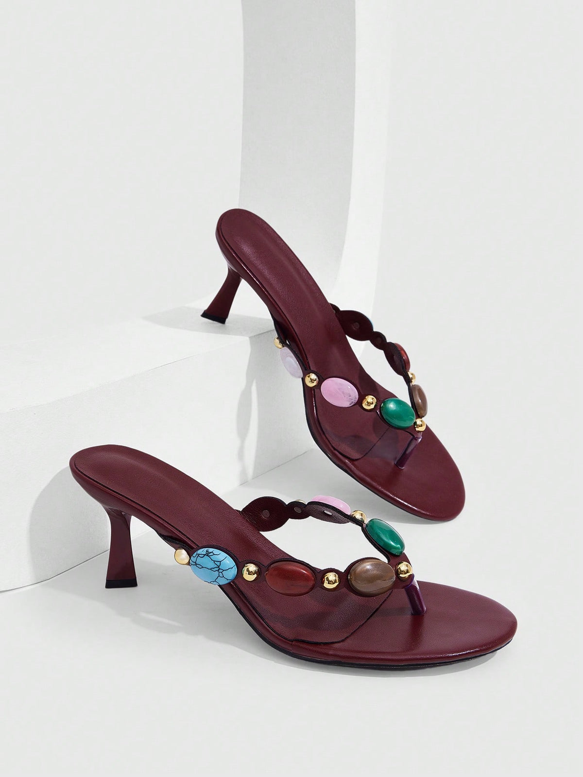 Elegant ladies strappy high-heeled slippers featuring a sleek toe post, buckle accent, and stiletto mid heel in smooth PU leather.