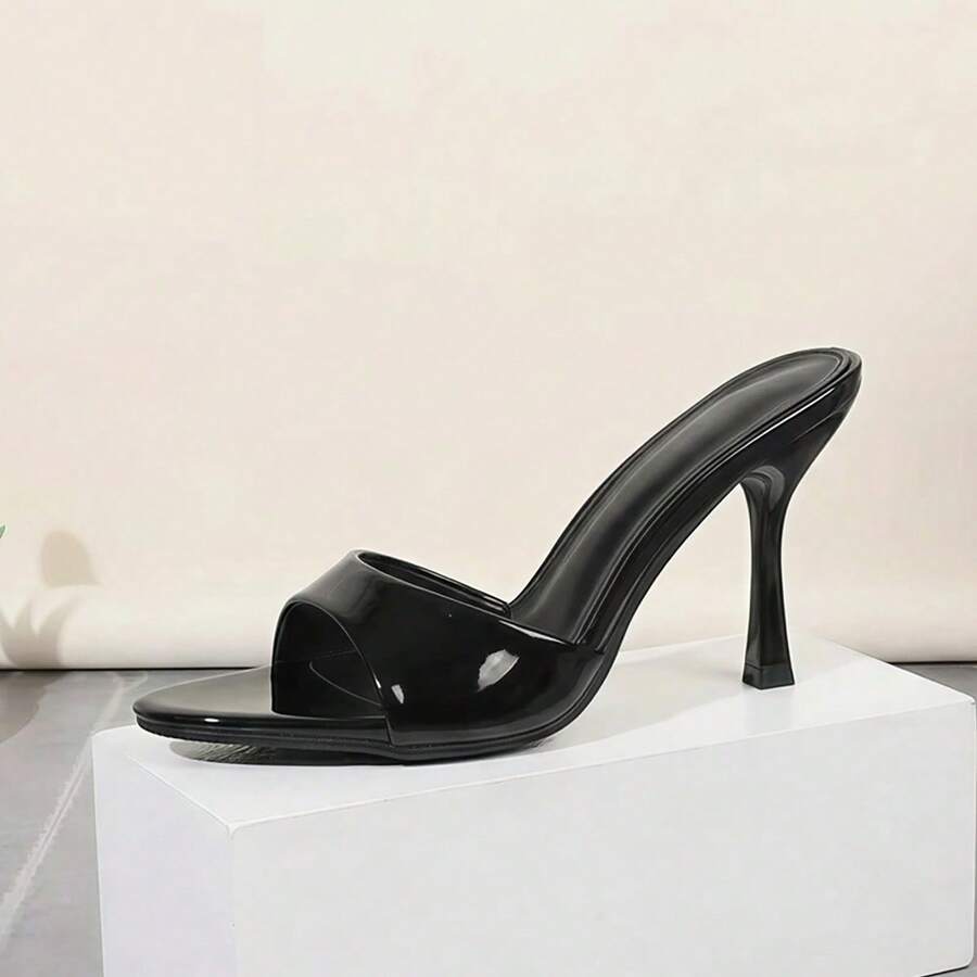 Women's open toe high heel sandals and slides featuring a slip-on design and mid pyramid heel.
