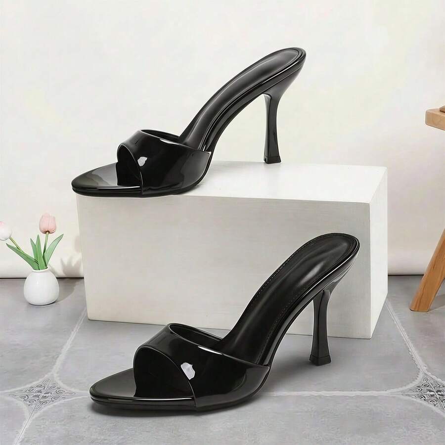 Women's open toe high heel sandals and slides featuring a slip-on design and mid pyramid heel.