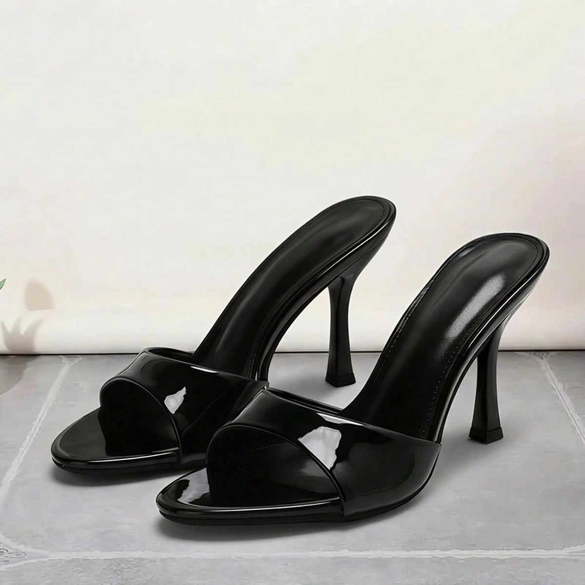 Women's open toe high heel sandals and slides featuring a slip-on design and mid pyramid heel.
