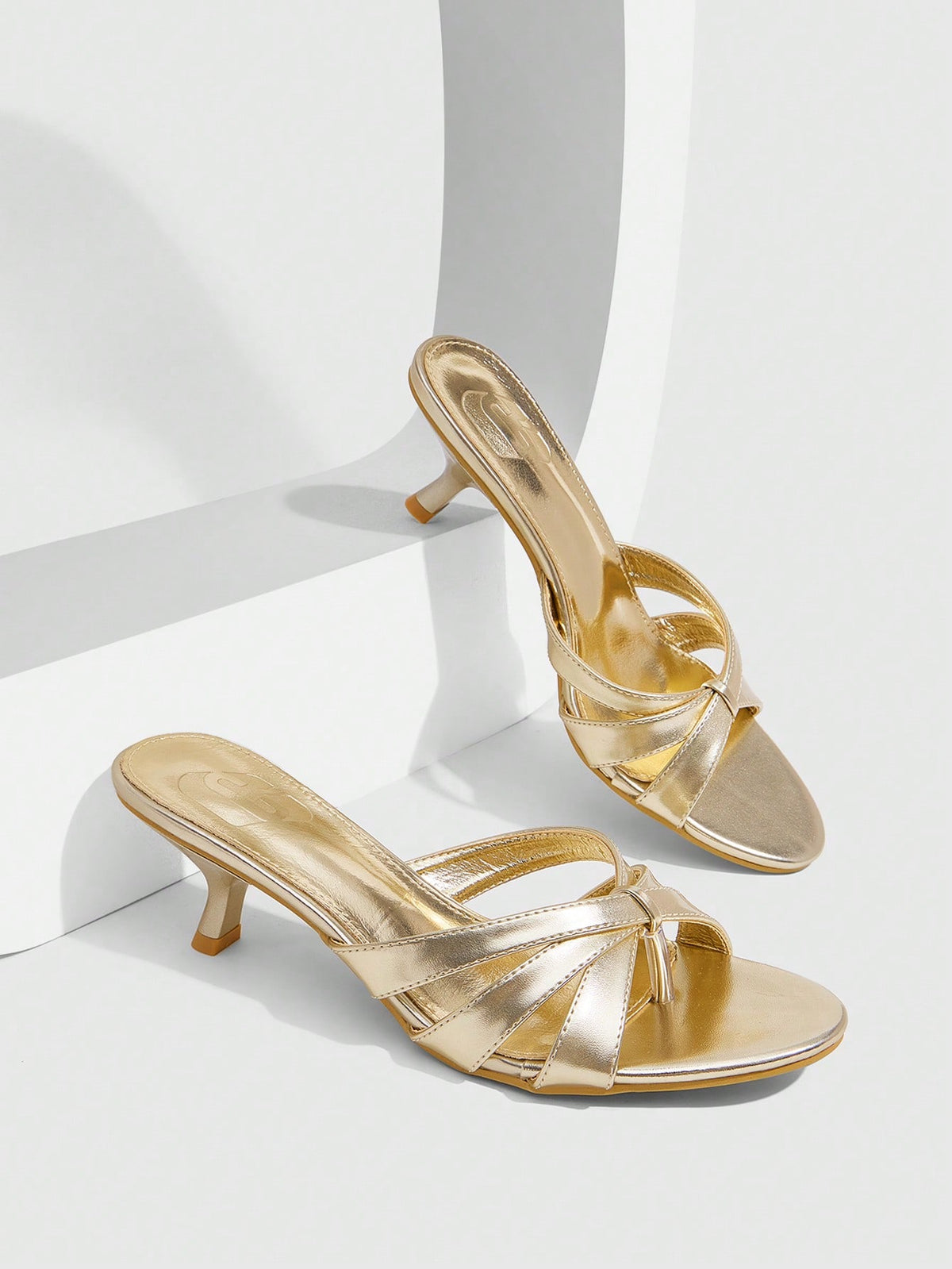 Women's open-toed high-heeled sandals featuring a 5.5cm kitten heel stiletto, sleek ankle strap with buckle closure, and smooth PU leather finish.