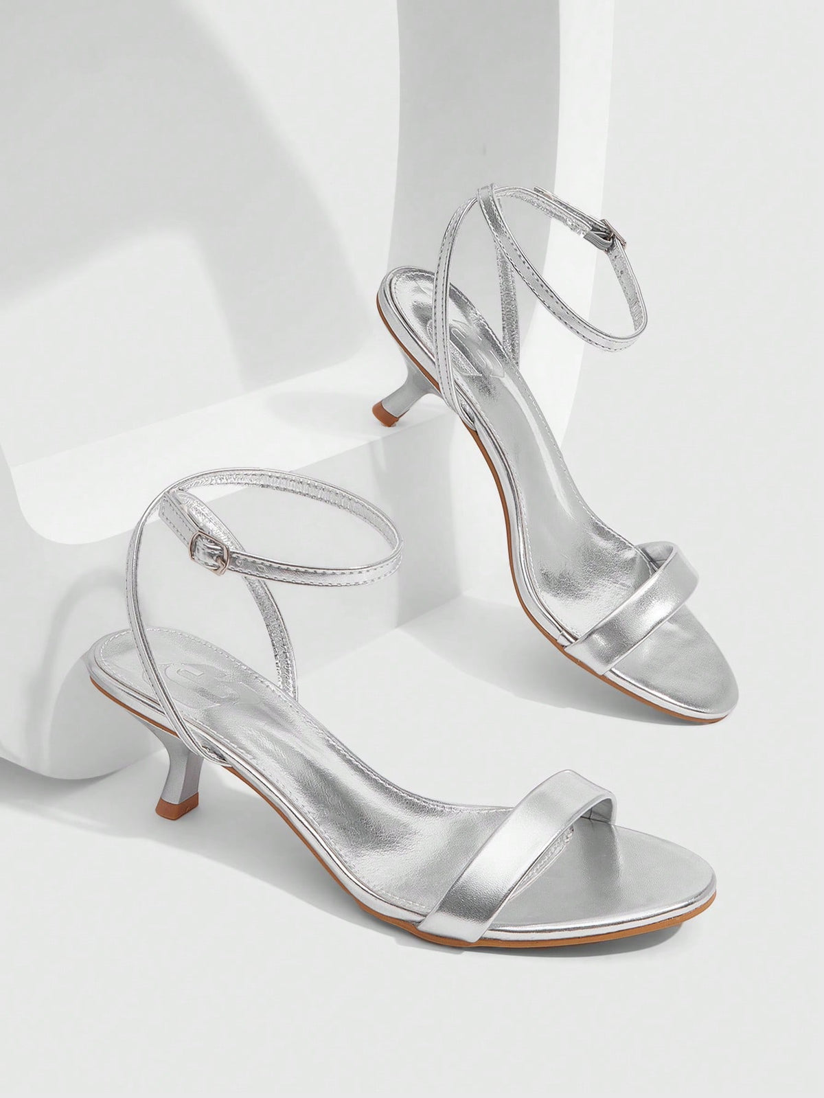 Women's open-toed high-heeled sandals featuring a 5.5cm kitten heel stiletto, sleek ankle strap with buckle closure, and smooth PU leather finish.
