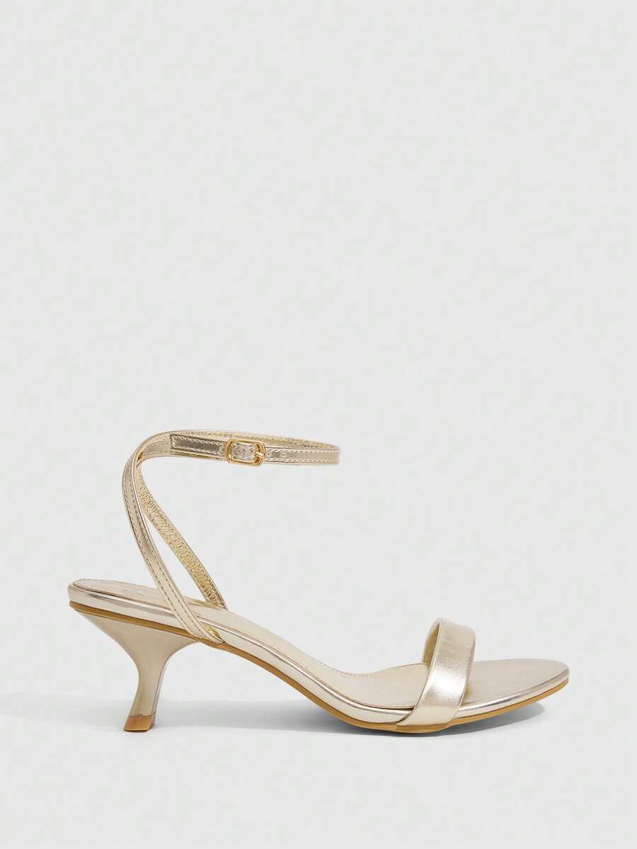 Women's open-toed high-heeled sandals featuring a 5.5cm kitten heel stiletto, sleek ankle strap with buckle closure, and smooth PU leather finish.