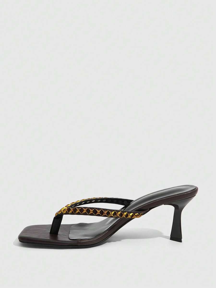 Elegant ladies strappy high-heeled slippers featuring a sleek toe post, buckle accent, and stiletto mid heel in smooth PU leather.