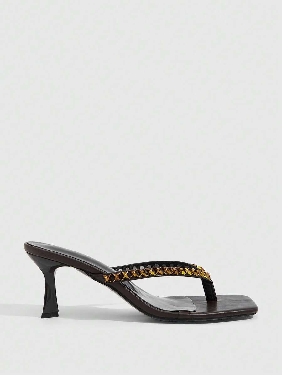 Elegant ladies strappy high-heeled slippers featuring a sleek toe post, buckle accent, and stiletto mid heel in smooth PU leather.
