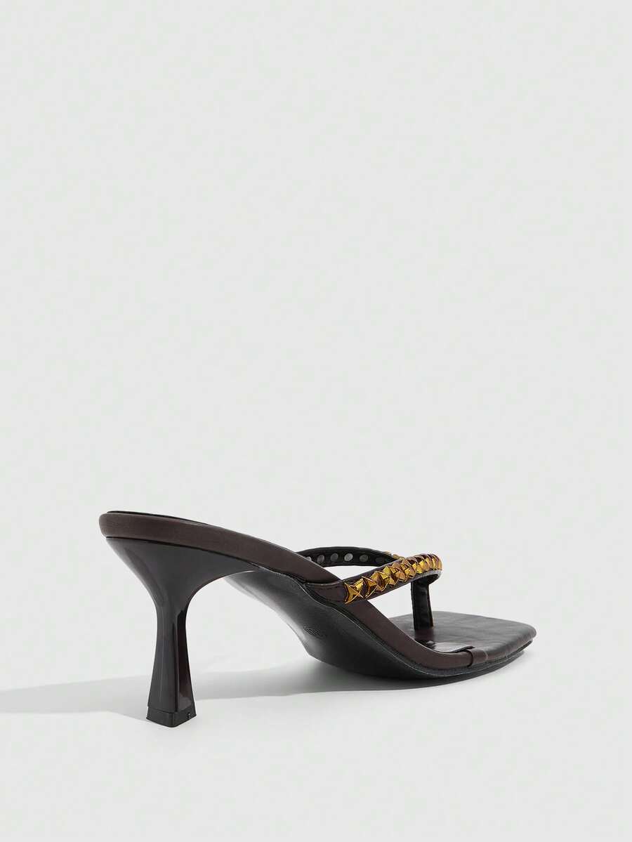 Elegant ladies strappy high-heeled slippers featuring a sleek toe post, buckle accent, and stiletto mid heel in smooth PU leather.
