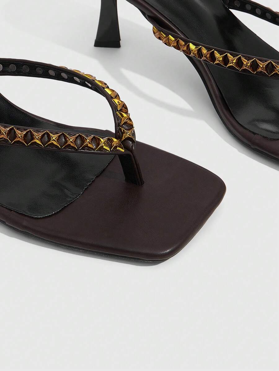 Elegant ladies strappy high-heeled slippers featuring a sleek toe post, buckle accent, and stiletto mid heel in smooth PU leather.