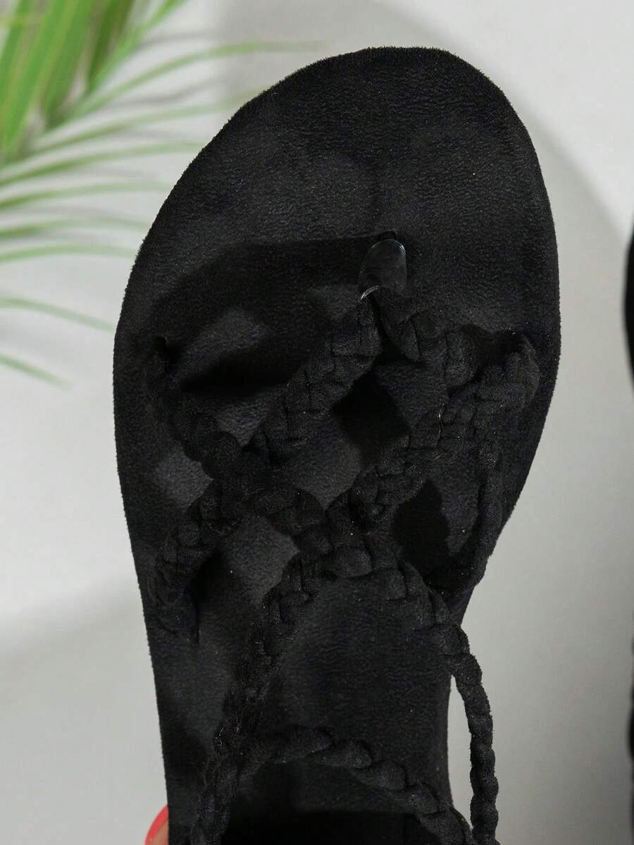 Women's lace-up flat slip-on sandals with round toe and hollow-out PU leather straps for beach and daily wear.
