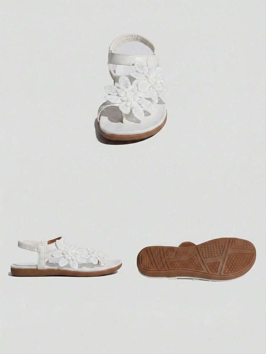 Women's lace-up flat slip-on sandals with round toe and hollow-out PU leather straps for beach and daily wear.