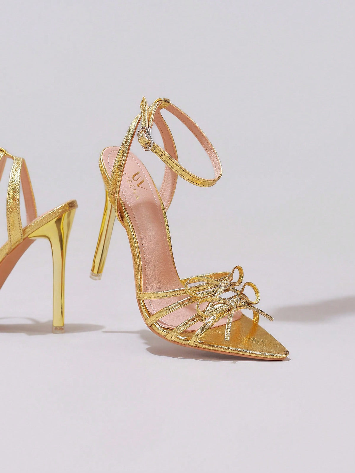 Lace stiletto high heel sandals with pointed open toe, ankle strap buckle, and bow detail