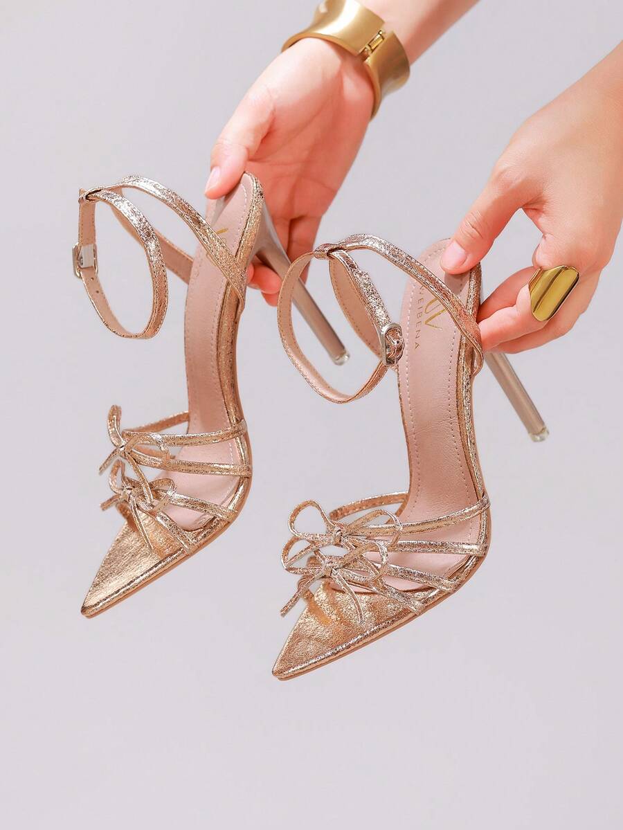 Lace stiletto high heel sandals with pointed open toe, ankle strap buckle, and bow detail