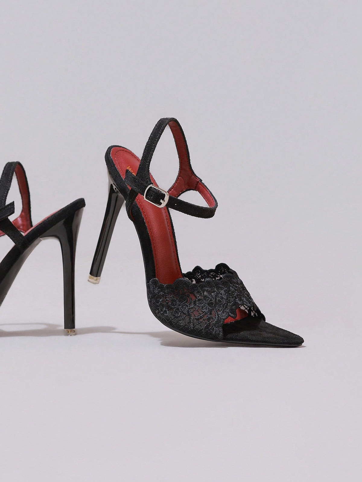 Lace stiletto high heel sandals with pointed open toe, ankle strap buckle, and bow detail