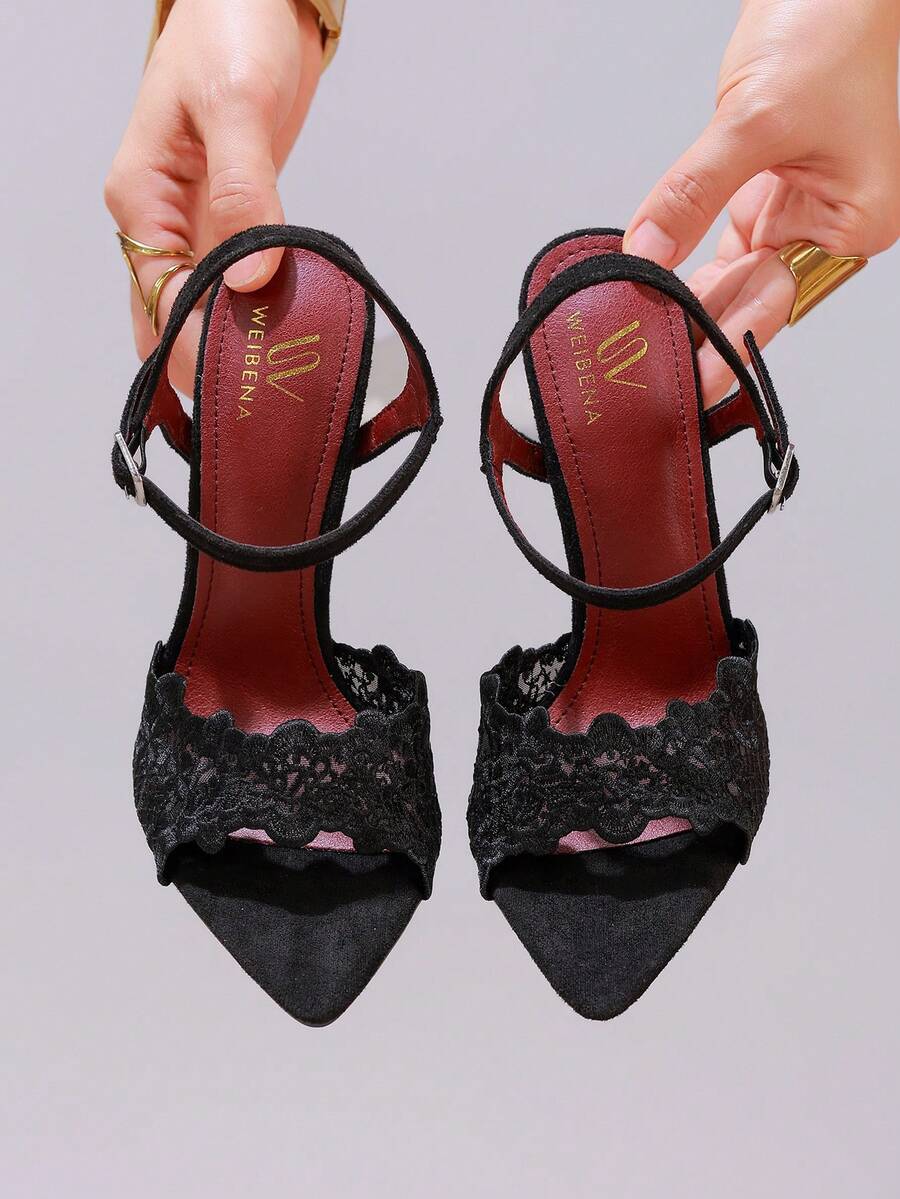 Lace stiletto high heel sandals with pointed open toe, ankle strap buckle, and bow detail