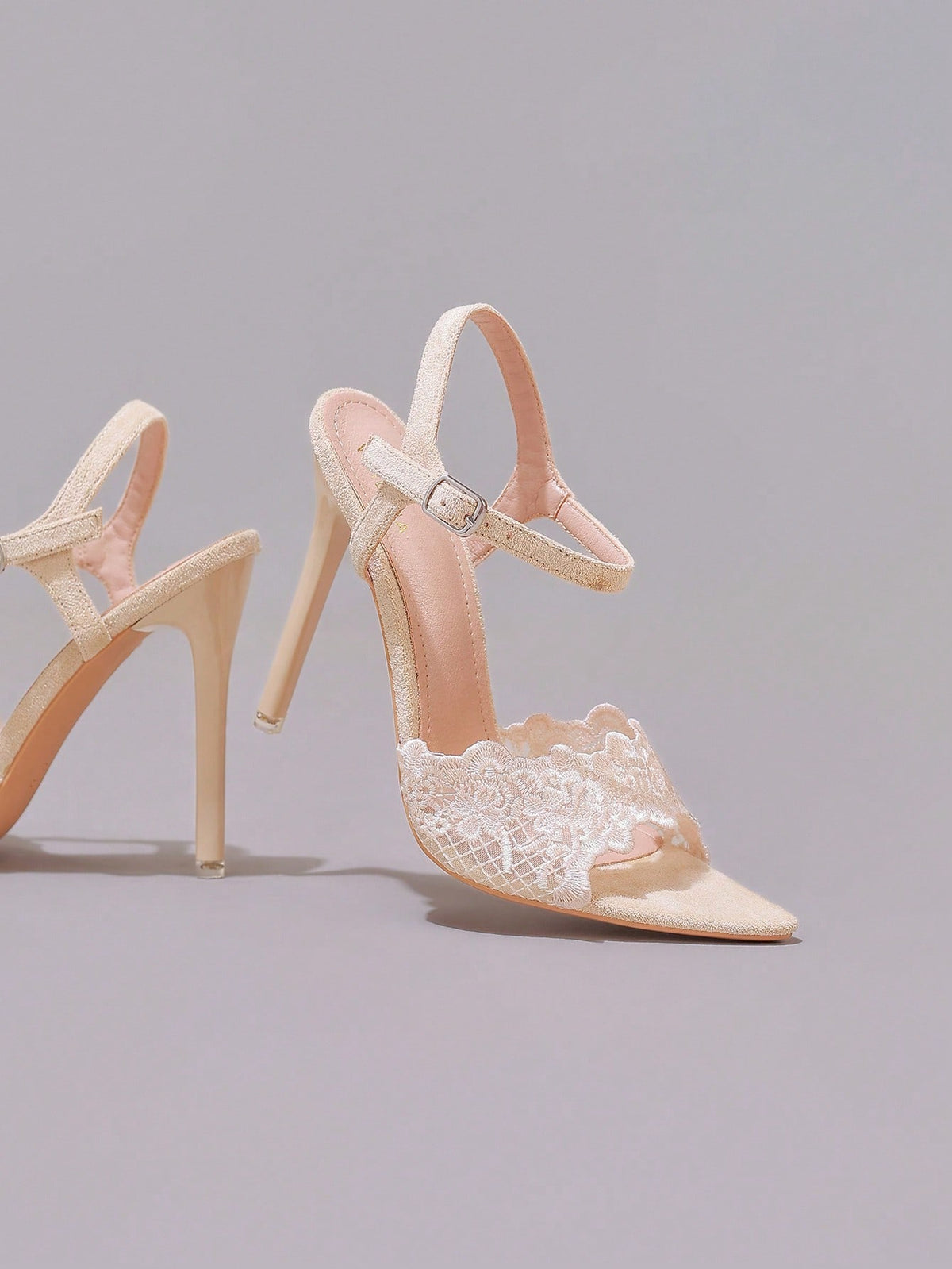 Lace stiletto high heel sandals with pointed open toe, ankle strap buckle, and bow detail