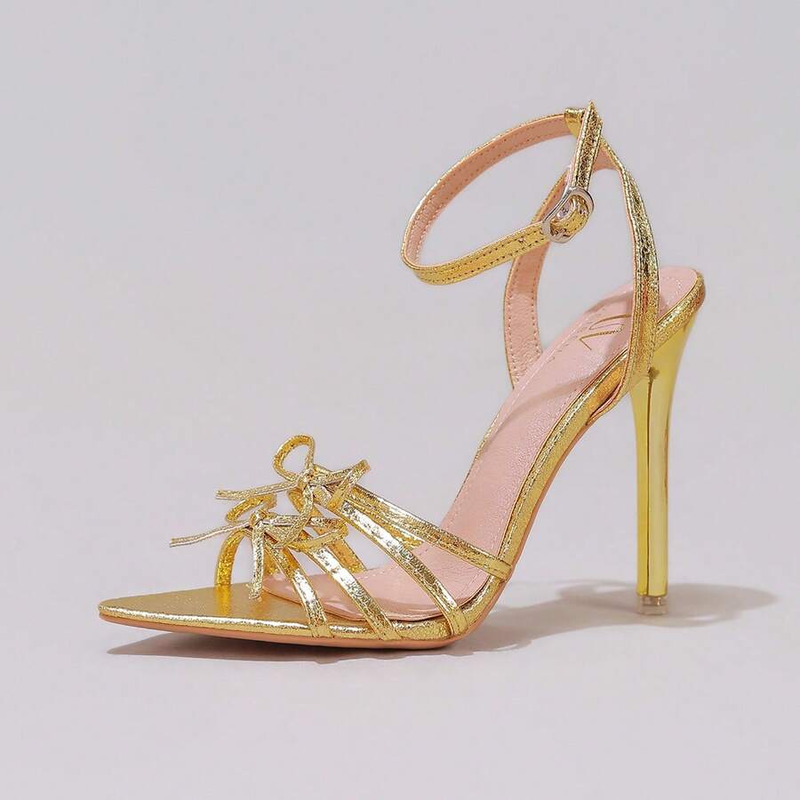 Lace stiletto high heel sandals with pointed open toe, ankle strap buckle, and bow detail