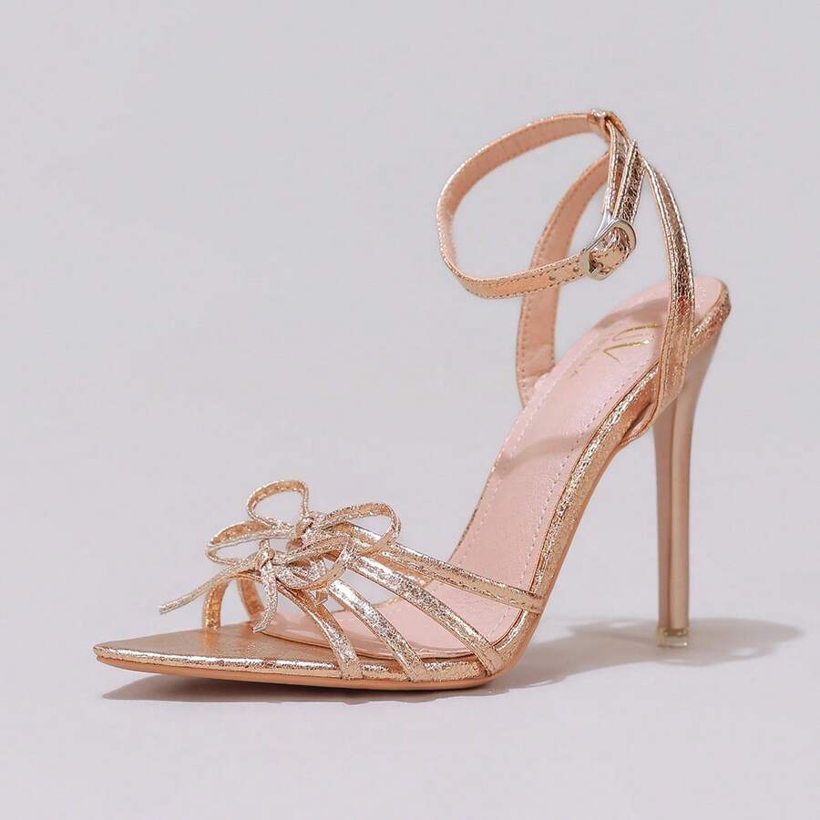 Lace stiletto high heel sandals with pointed open toe, ankle strap buckle, and bow detail