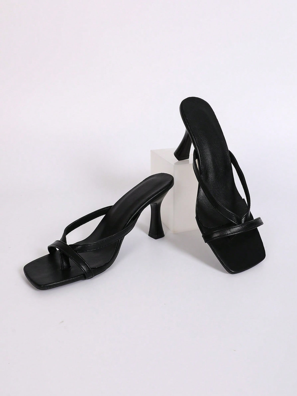 Women's open square toe high heel thong sandals with a sleek slip-on strap and stiletto heel.