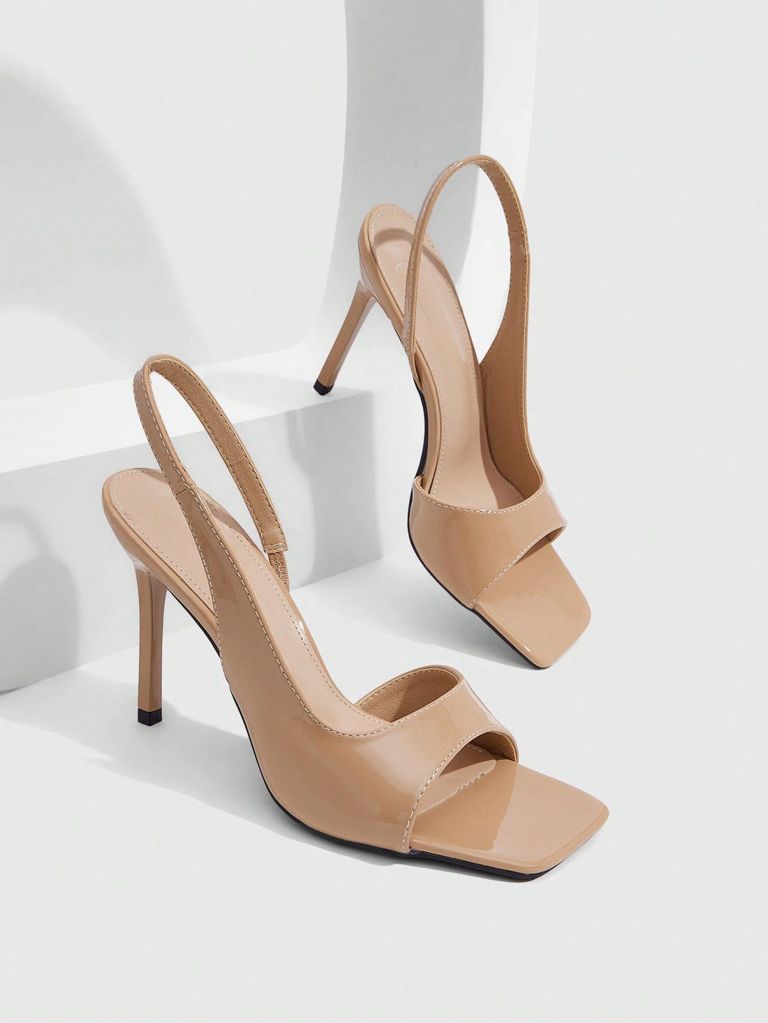 Women's burgundy open toe high heel sandals featuring an embossed finish and slingback strap