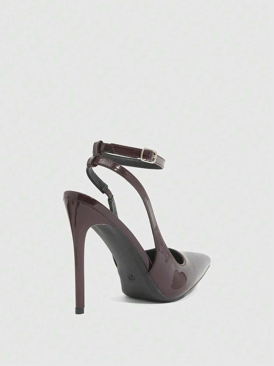 Pointed toe stiletto high heels with slingback silhouette and adjustable buckle ankle strap.