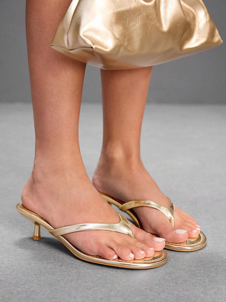 Women's kitten heel flip flop sandals featuring sleek PU leather straps, open toe, and low kitten heel.