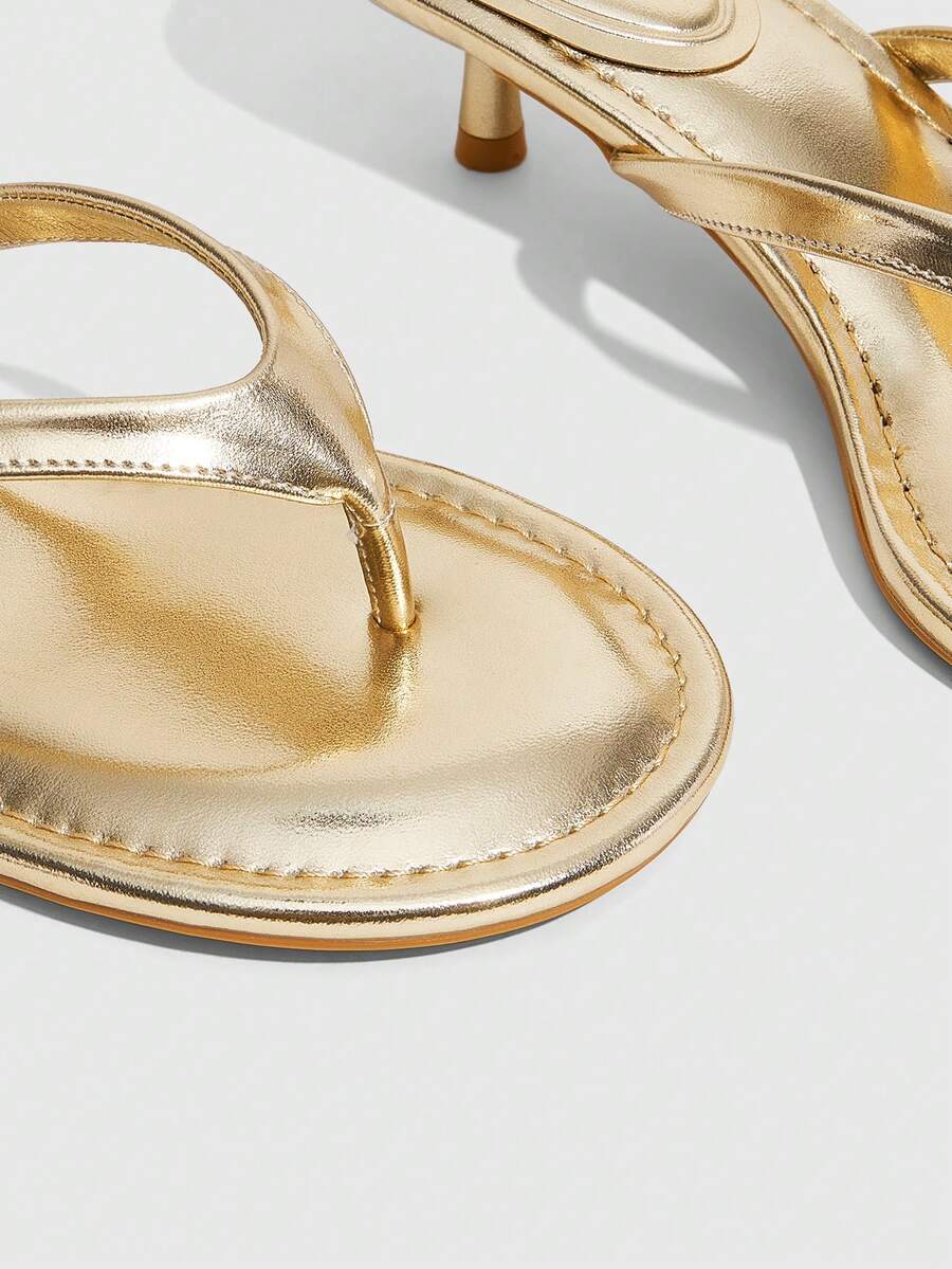 Women's kitten heel flip flop sandals featuring sleek PU leather straps, open toe, and low kitten heel.