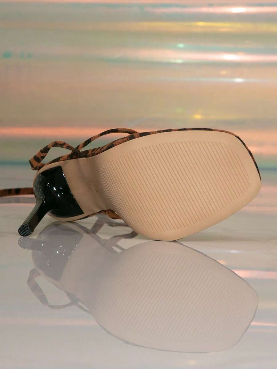 Women's stiletto high heel thong sandals featuring a T-strap toe loop design and ankle buckle strap