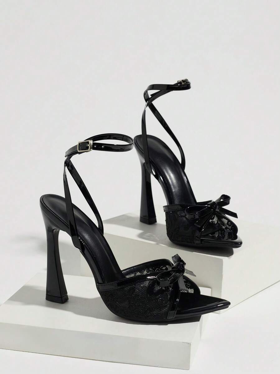 Burgundy open-toe high heels featuring an adjustable ankle strap with buckle closure and high stiletto heel.
