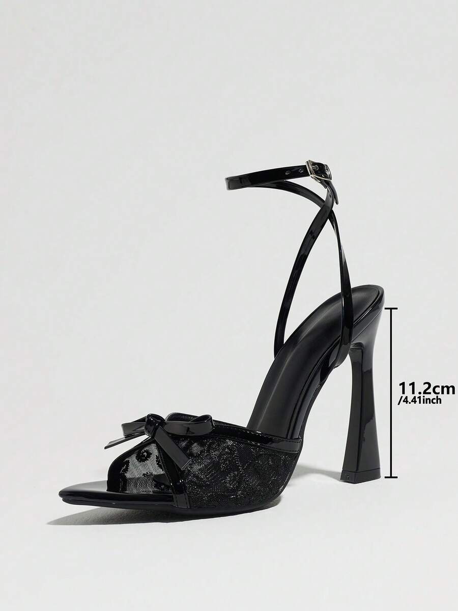 Burgundy open-toe high heels featuring an adjustable ankle strap with buckle closure and high stiletto heel.
