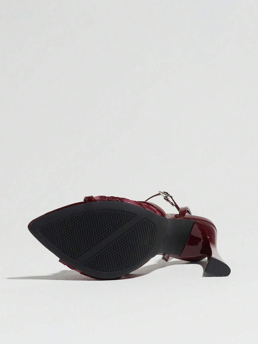 Burgundy open-toe high heels featuring an adjustable ankle strap with buckle closure and high stiletto heel.