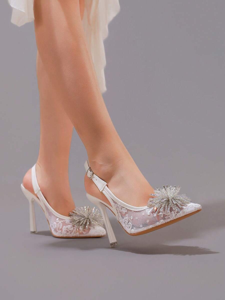 White pointed toe high heel stiletto sandals featuring lace patchwork, fringe trim, and an oversized bowknot accent.