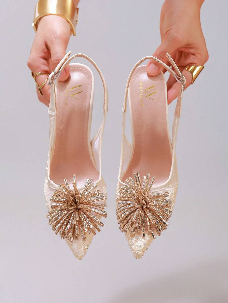 White pointed toe high heel stiletto sandals featuring lace patchwork, fringe trim, and an oversized bowknot accent.