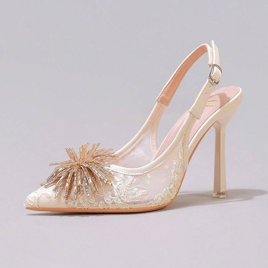 White pointed toe high heel stiletto sandals featuring lace patchwork, fringe trim, and an oversized bowknot accent.