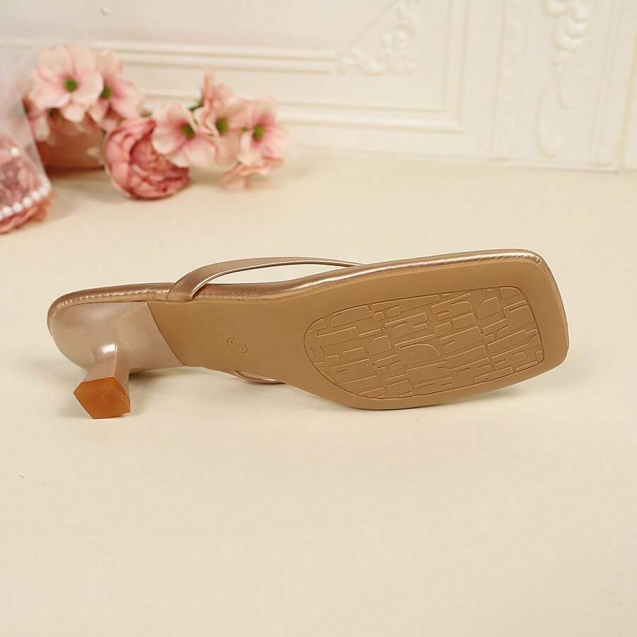 Women's square toe kitten heel thong sandals featuring a sleek toe-post strap and low heel design