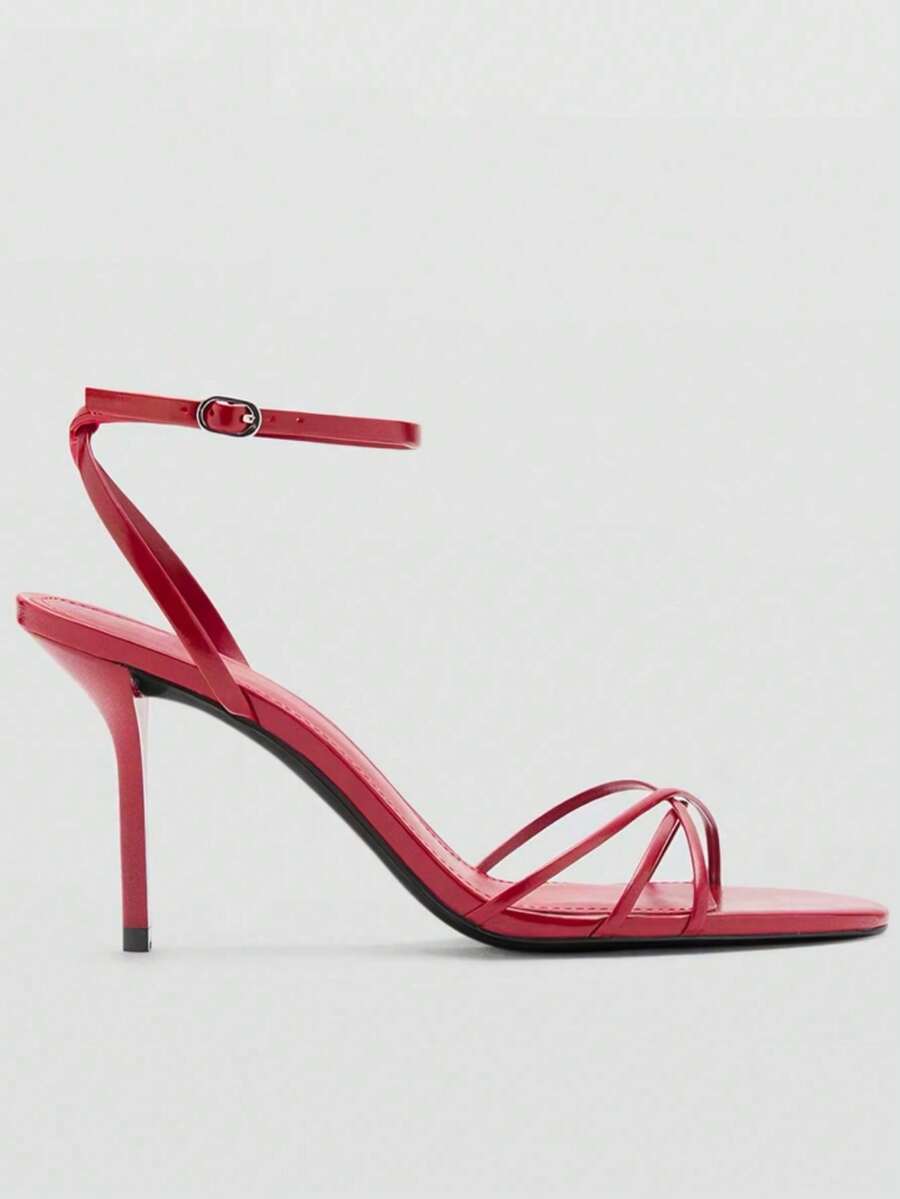 Women's open toe stiletto high heel sandals featuring metallic knot decor and an adjustable ankle buckle strap.